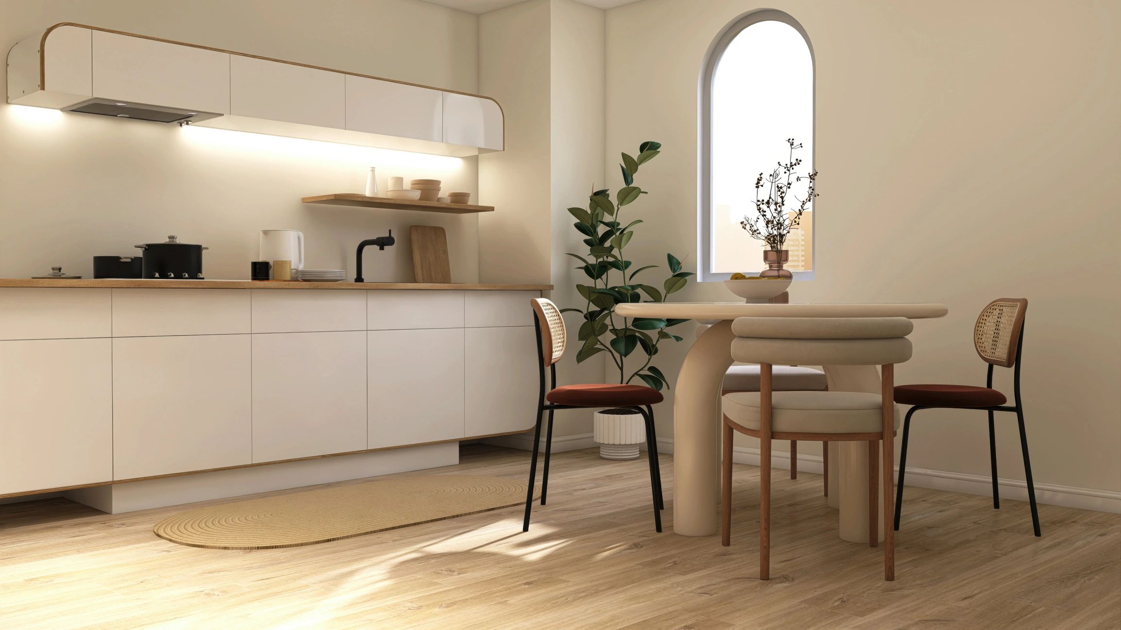 Modern cream kitchen and dining room with soft sunlight